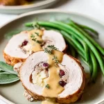 Cranberry Stuffed Turkey Roll on a Festive Table