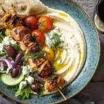 Mediterranean Chicken Skewers with Hummus on a Plate