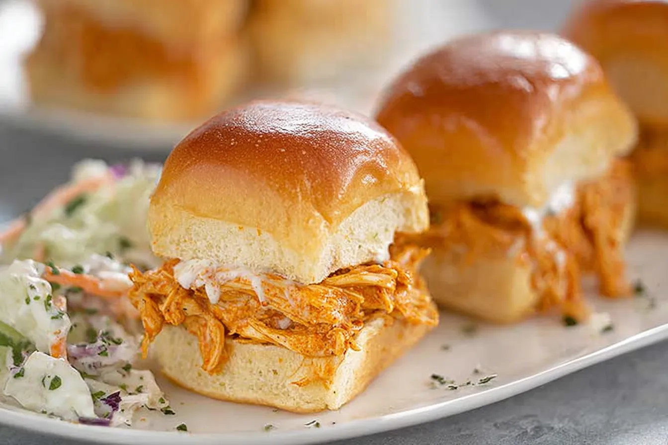 Buffalo Chicken Sliders — Spicy shredded chicken and creamy ranch on soft rolls