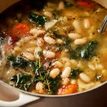 Tuscan White Bean Soup in a Bowl with Fresh Herbs