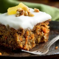Pineapple Carrot Cake: A Delightful Tropic Treat! Pineapple Carrot Cake Slice with Cream Cheese Frosting