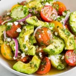Fresh Cucumber Tomato Avocado Salad on a Plate