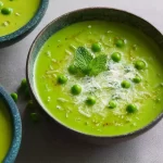 Fresh Pea and Mint Soup in a Bowl with Mint Leaves