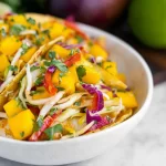 Crispy Fish Tacos with Mango Slaw on a Plate