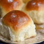 Soft and Fluffy Homemade Dinner Rolls on a Baking Sheet