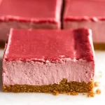 No-Bake Strawberry Cheesecake Bars Served on a Plate