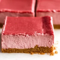 No-Bake Strawberry Cheesecake Bars Served on a Plate