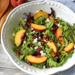 Colorful Peach and Pecan Summer Salad in a Bowl