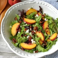 Peach and Pecan Summer Salad: A Deliciously Fresh Twist Colorful Peach and Pecan Summer Salad in a Bowl