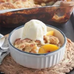 Delicious Peach Cobbler with Vanilla Ice Cream