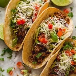 Colorful Tacos Garnished with Fresh Ingredients