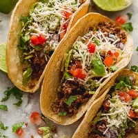 Colorful Tacos Garnished with Fresh Ingredients
