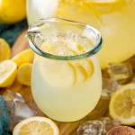 Homemade Lemonade in a Pitcher with Fresh Lemons
