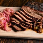 Smoked Beef Brisket Slice on a Cutting Board