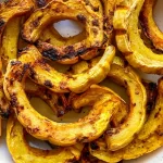Roasted Delicata Squash Slices on a Rustic Plate