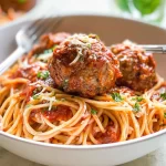 Delicious Spaghetti and Meatballs Served with Fresh Herbs